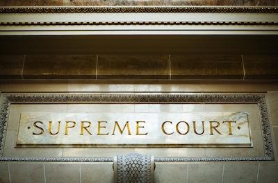 stone lintel with words supreme court